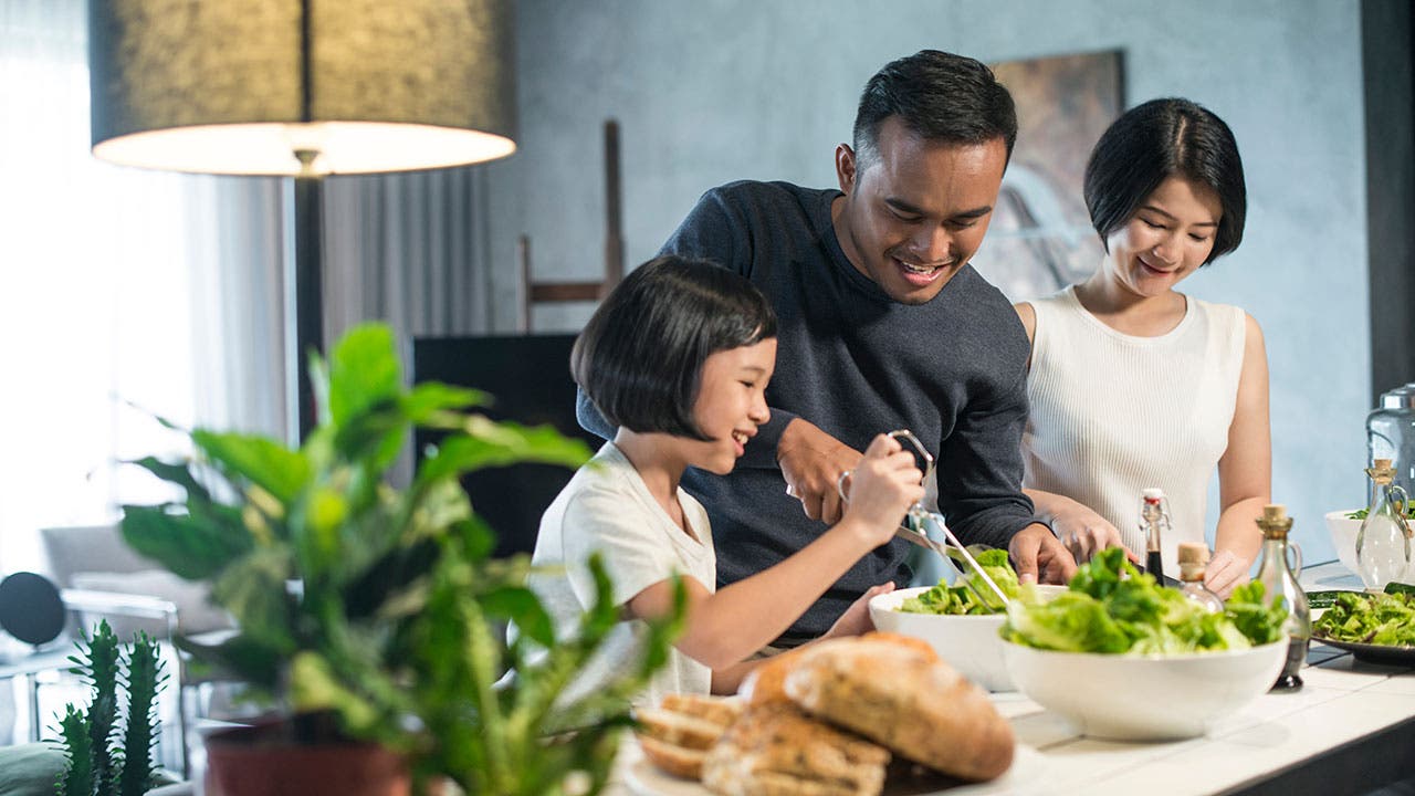 Family making salad together