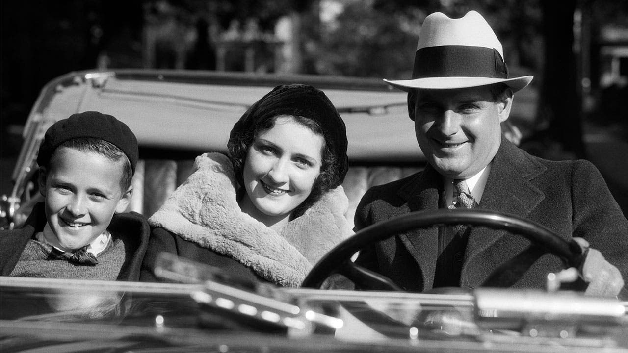 Family in convertible car