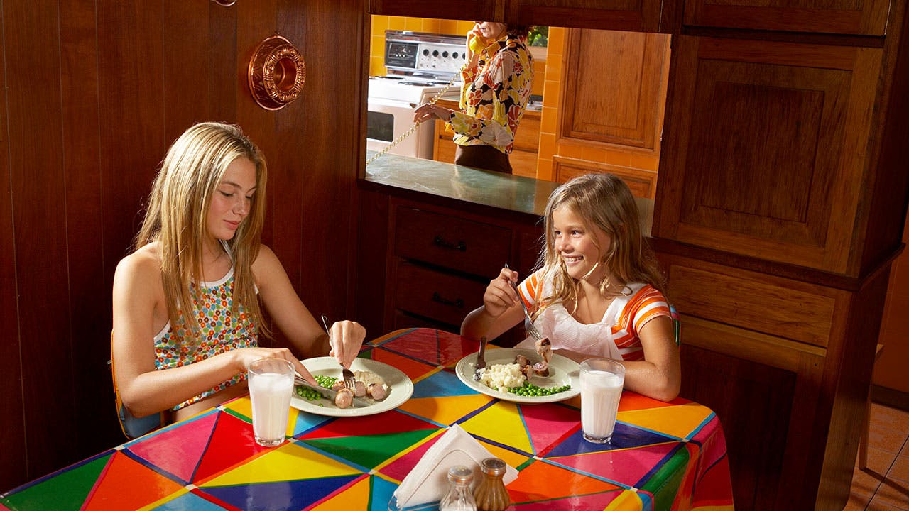 Sisters eating lunch in 1970s