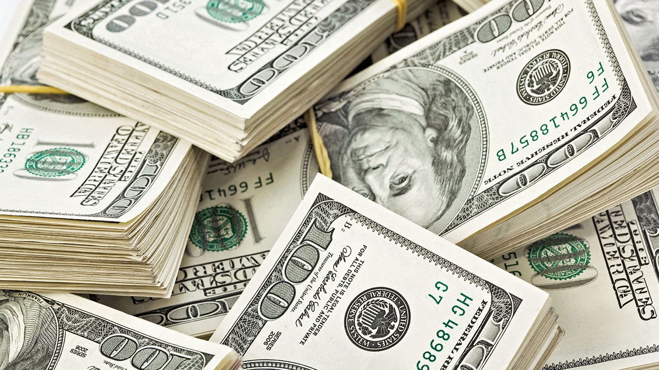 Piles of $100 bills