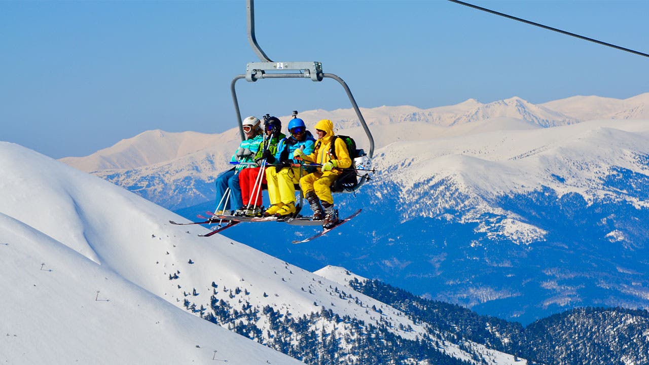 Skiers on ski lift