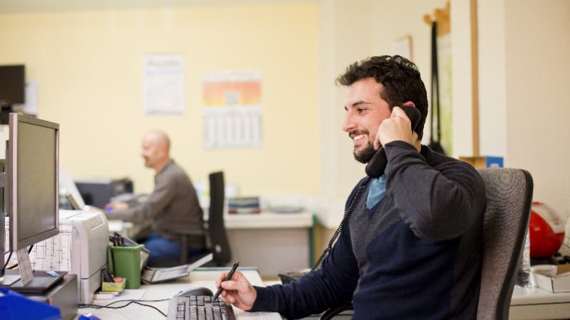 man talking on phone in office
