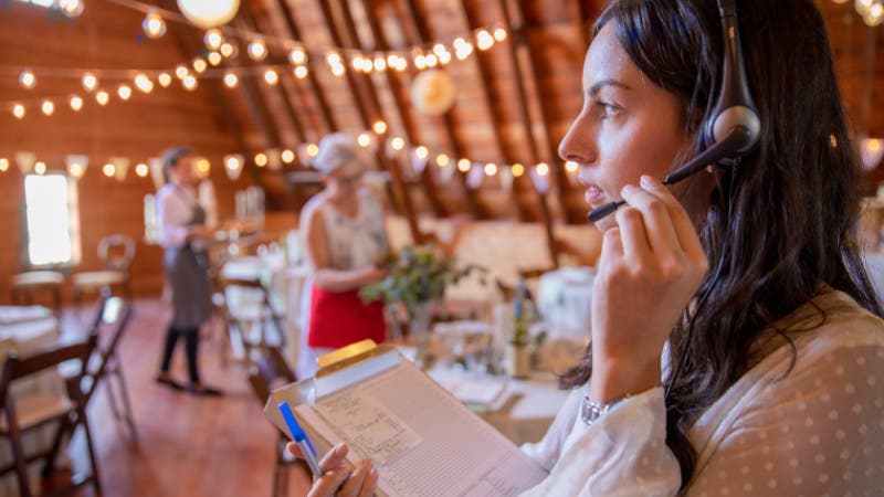 wedding planner holding clipboard