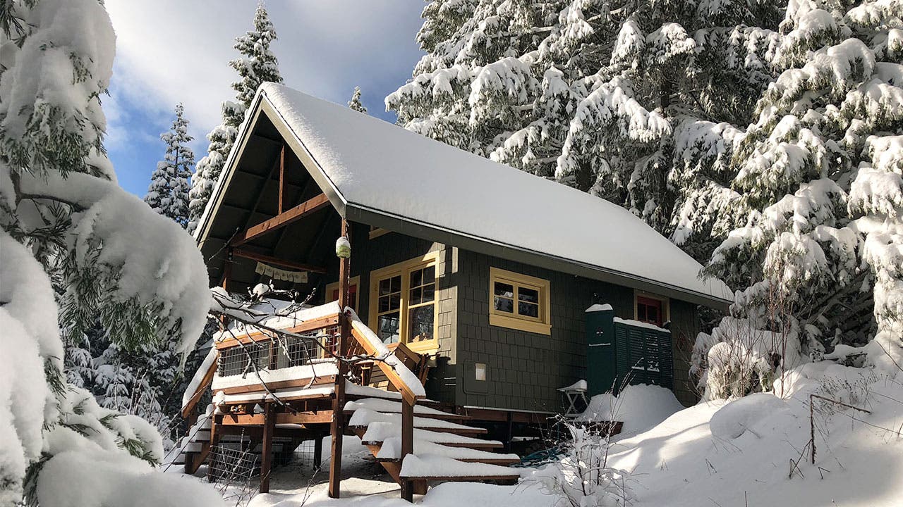 Cabin in the woods with snow