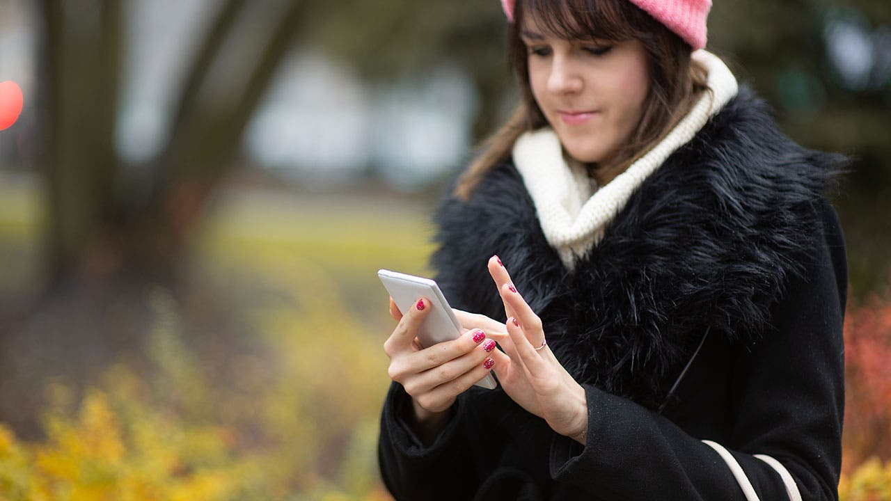 Woman texting on phone
