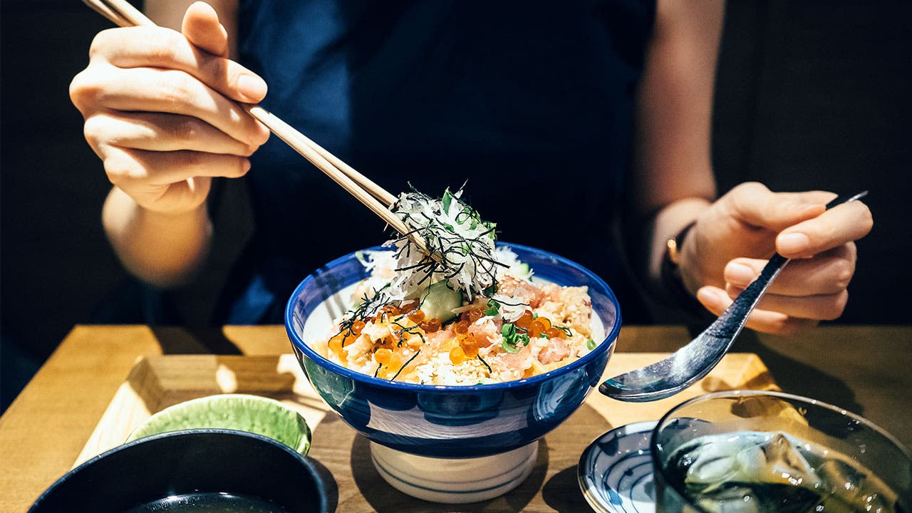 Woman eating Japanese food