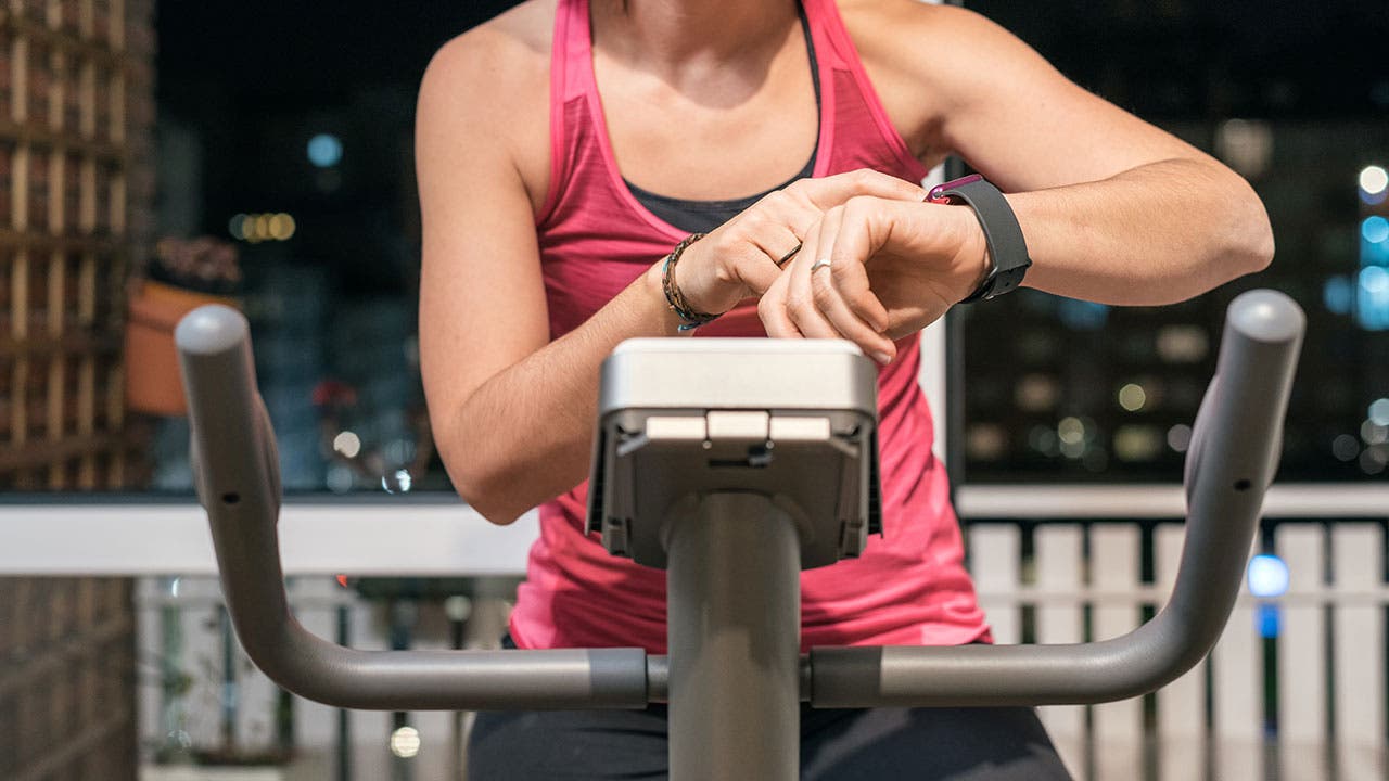 Woman using indoor cycle