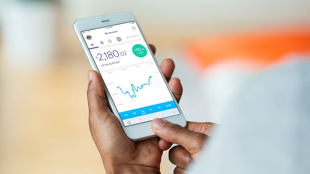 5 Best Investment Apps In June 2019 Bankrate Com - man using a stockpile app