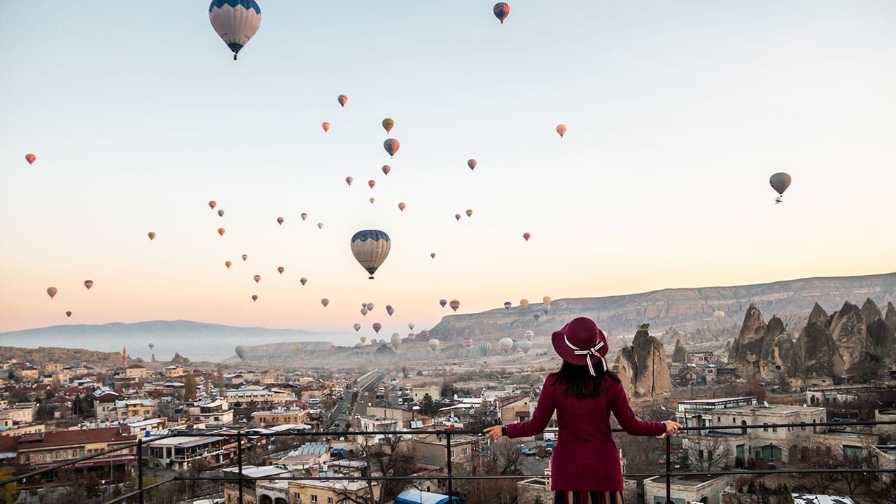 Woman solo traveller watching a balloon festival