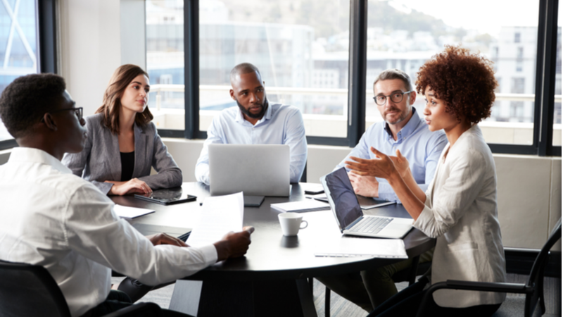 Young African American businesswoman leads meeting