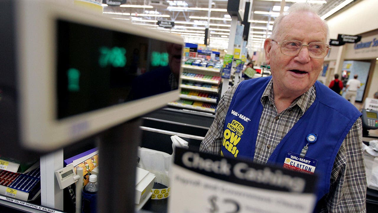 Walmart clerk at register