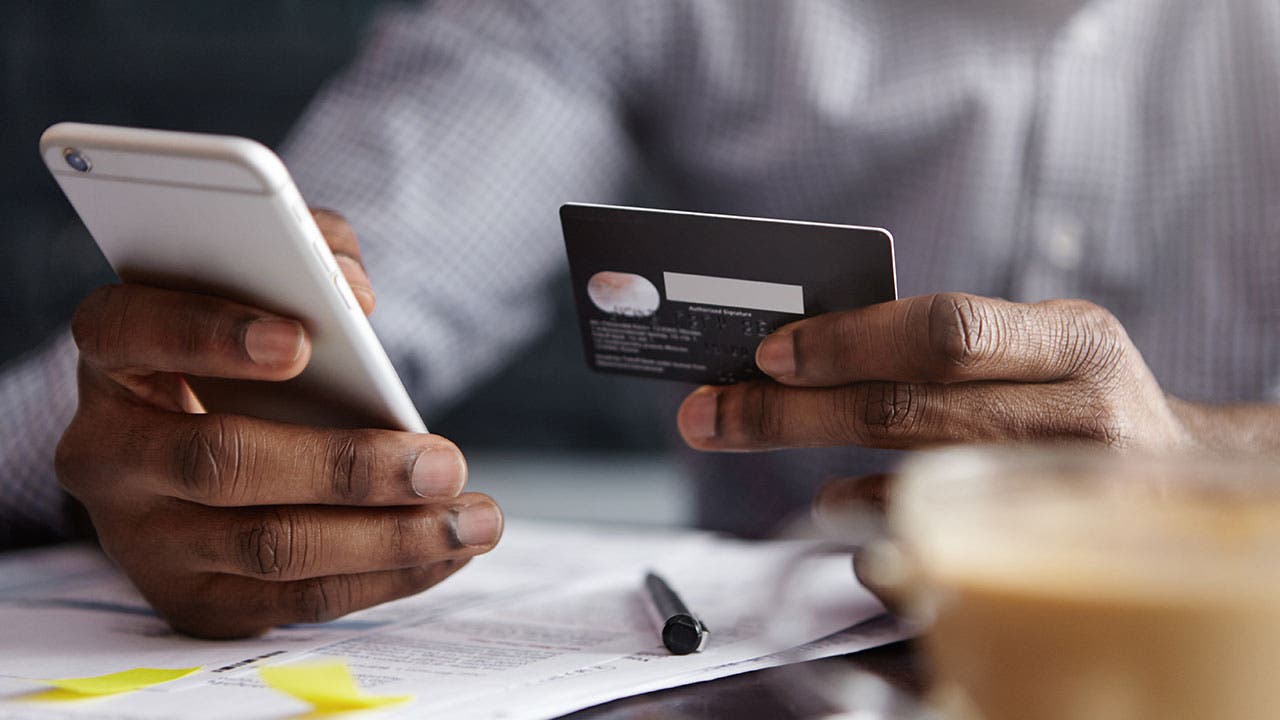 Man checking credit card balance