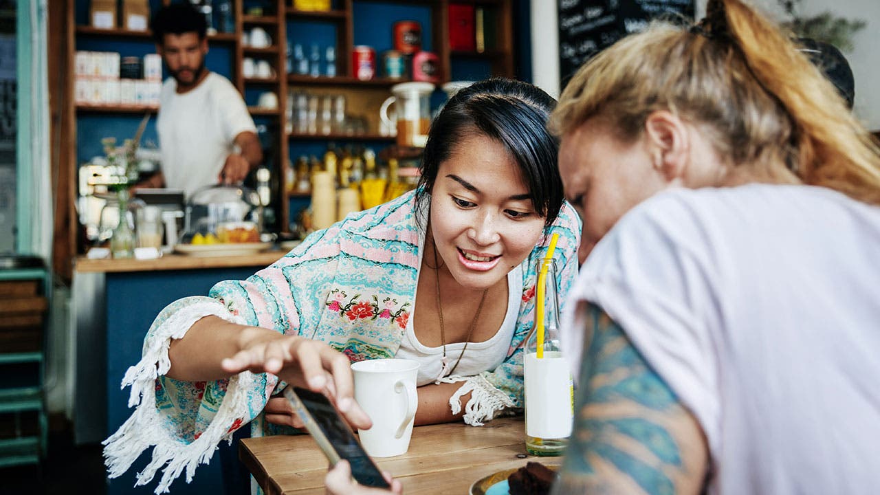 Millennials trends looking at phone