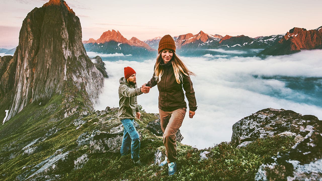 Couple on top on a mountain in Norway