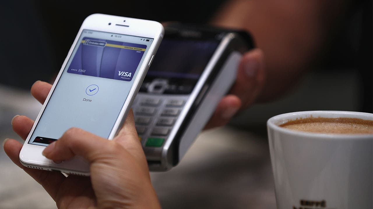 Woman using Apple Pay