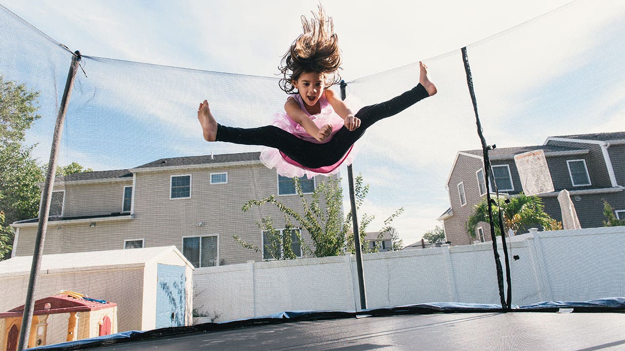 Girl jumping on trampoline