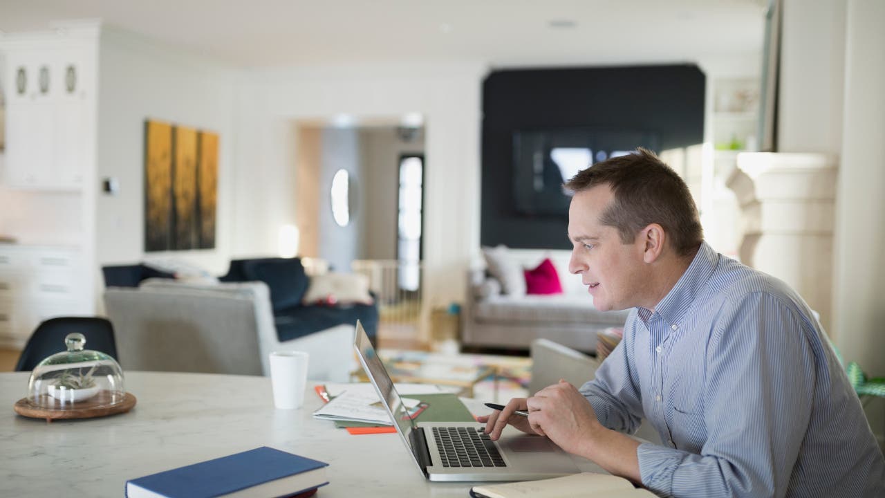 man working on his computer