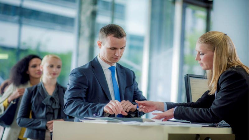 A man is doing business at a bank.