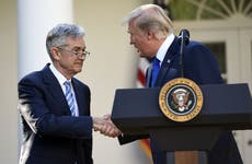 President Donald Trump shakes the hand of Fed Chairman Jerome Powell