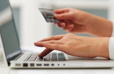 Person holding credit card