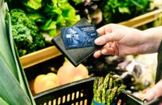 Person holding Amex credit card