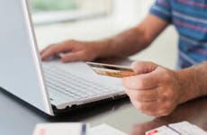 Person on computer with credit card