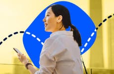 An Asian woman looks hapy against a blue and yellow background